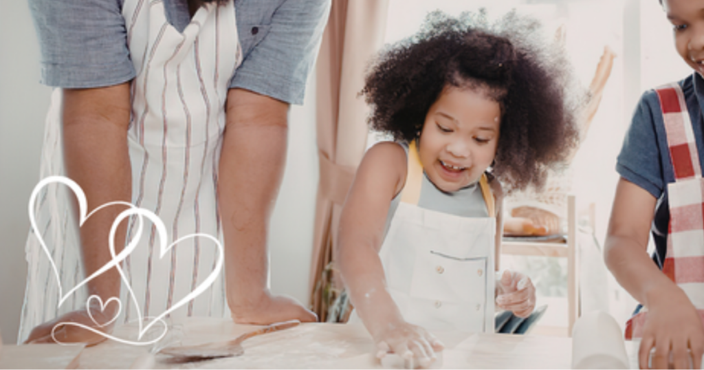 Children and adult baking together in a kitchen, illustrating how churches can invite and disciple people into foster care ministry